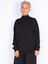 Knitted sweater with high neck